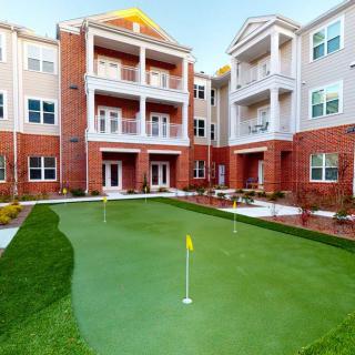 Apartment complex with a mini-golf putting green.