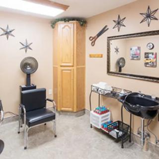 A well-equipped hairdressing salon with stylish decor and essential tools.