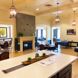 A modern dining area with a fireplace and elegant decor.