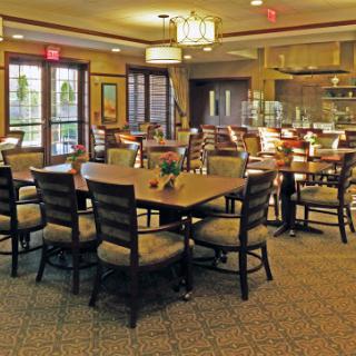 A warm and inviting dining area with wooden tables and comfortable chairs, perfect for casual meals.