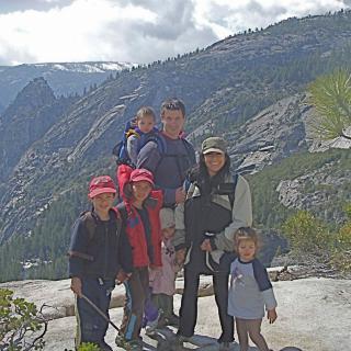 A family enjoying a hiking trip in the mountains.