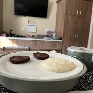 A simple breakfast featuring rice and sausage.