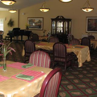A welcoming dining area featuring elegantly arranged tables and chairs.