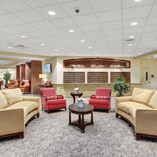 A modern lobby with comfortable seating and warm lighting.