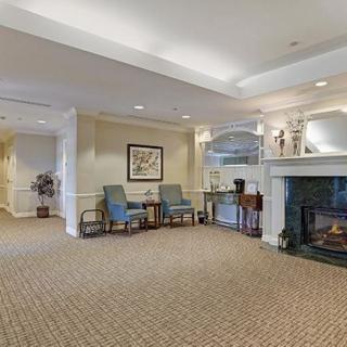 A spacious lobby area with a cozy fireplace and comfortable seating.