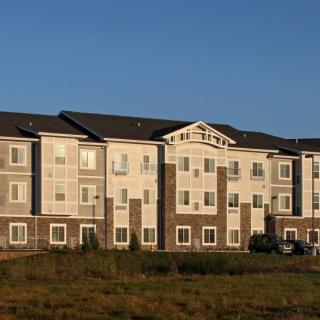 A hotel building exterior at sunset.