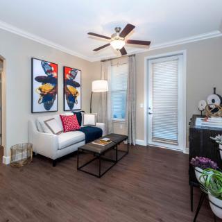 A modern living room with contemporary artwork, a comfortable sofa, and stylish decor.
