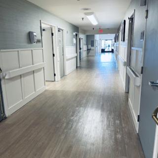 A bright and clean hallway in a hospital setting.