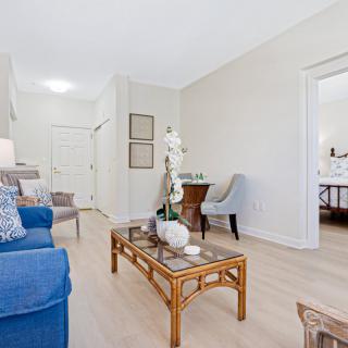 A bright and modern living room with stylish furniture and decor.