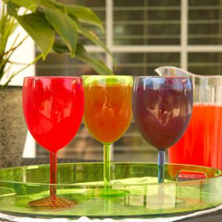 A vibrant display of colorful drinks on a sunny day.