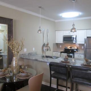 Modern open-layout kitchen and dining area with stylish decor.