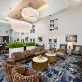 A modern hotel lobby with comfortable seating and stylish decor.