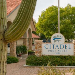Entrance view of Citadel with a cactus in the foreground.