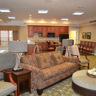 An inviting open-concept living and kitchen area with comfortable seating and modern furnishings.