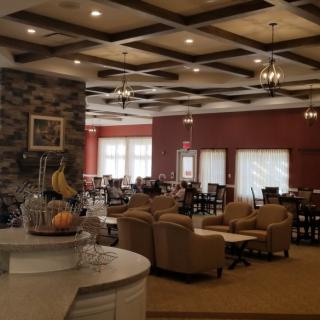 A cozy dining area with comfortable seating and warm lighting.