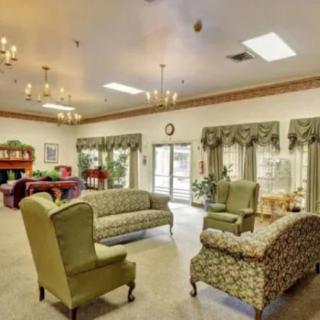 A cozy living room with vintage furniture and chandeliers.