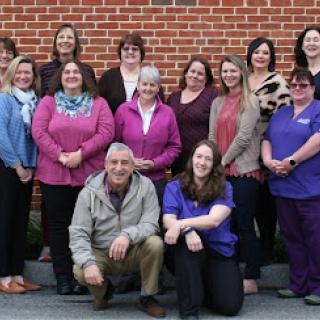 A team of dedicated professionals gathered for a group photo, showcasing their camaraderie and teamwork.
