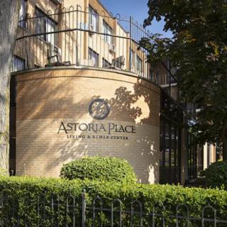 The exterior of Astoria Palace Hotel, showcasing its architectural design and surrounding greenery.