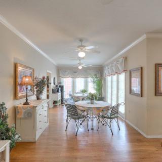 A bright and airy dining room with elegant decor and ample natural light.