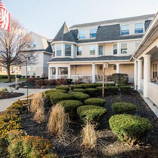A well-maintained residential building with landscaped gardens.