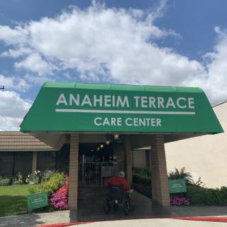 Entrance to Anaheim Terrace Care Center with a green awning.