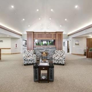 A spacious and modern living room with comfortable seating and elegant decor.