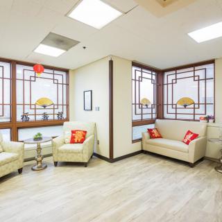 A cozy waiting room with comfortable seating and decorative elements.