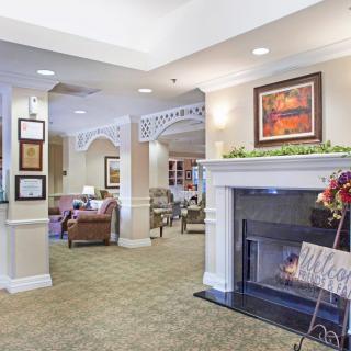 A cozy living room with a fireplace and comfortable seating.