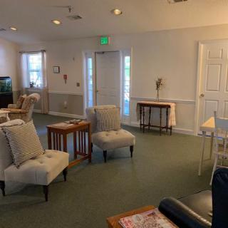 A cozy living room with comfortable seating and simple decor.