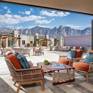 A luxurious patio with comfortable seating and a stunning mountain view.