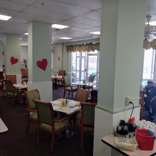 A cozy dining area decorated with heart motifs, inviting a warm atmosphere for guests.