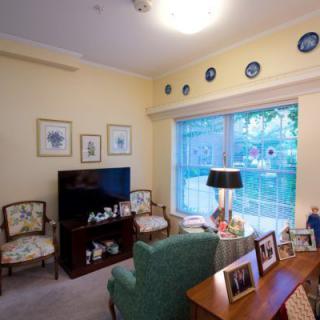 A cozy living room with seating, television, and decorative accents.