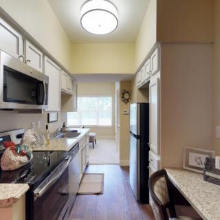 A modern kitchen with sleek appliances and ample cabinet space.