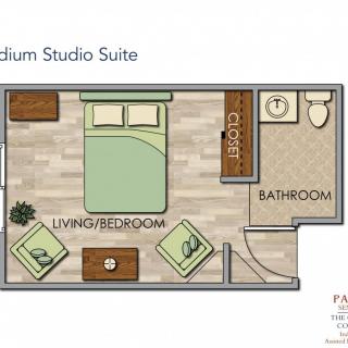 A floor plan of a medium studio suite featuring a living and bedroom area with adjacent bathroom.