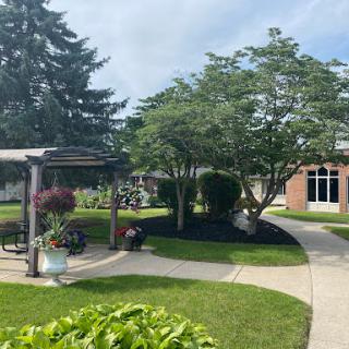 A serene outdoor space featuring well-kept gardens and walkways.