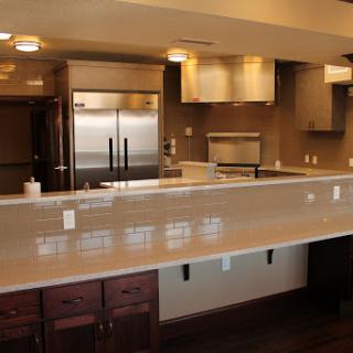 A modern and spacious kitchen featuring sleek appliances and an elegant countertop.