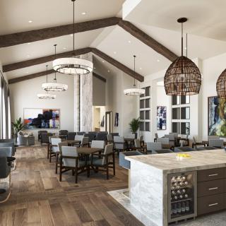 A modern dining area with a kitchen island, featuring stylish pendant lighting and wooden flooring.