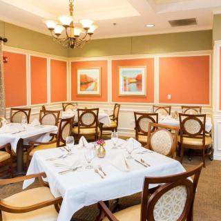 An elegant dining room with neatly set tables and stylish decor.