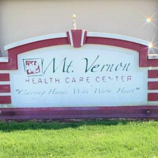 Sign for Mt. Vernon Health Care Center displayed outdoors.
