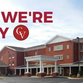 Exterior view of a healthcare facility with a welcoming message.
