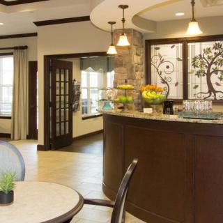A modern reception area with stylish furnishings and decorative elements.