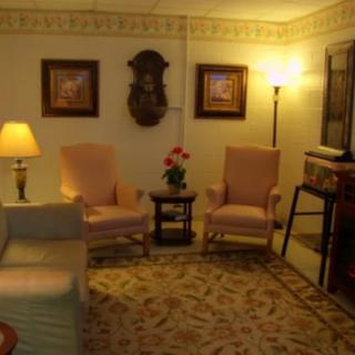A cozy living room with traditional furniture and warm lighting.