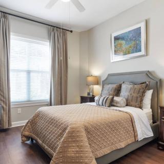 A cozy bedroom with elegant decor and natural light.