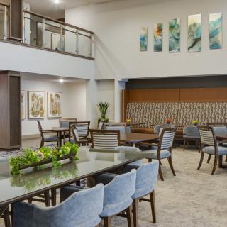A modern lobby with stylish furniture and decorative artwork.