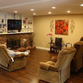 Cozy living room with recliners, a fireplace, and modern decor.