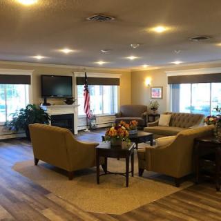 A cozy and modern living room with sofas, a coffee table, and a TV.