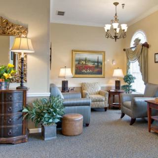 A cozy and well-decorated living room with comfortable seating and elegant decor.