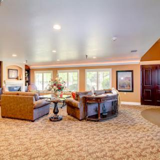 A cozy and inviting living room featuring comfortable seating and ample natural light.