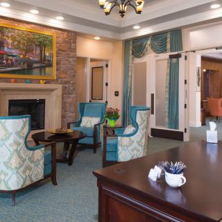 A cozy living room with elegant furniture and a fireplace.
