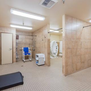 A spacious, accessible bathroom designed for both personal hygiene and exercise.